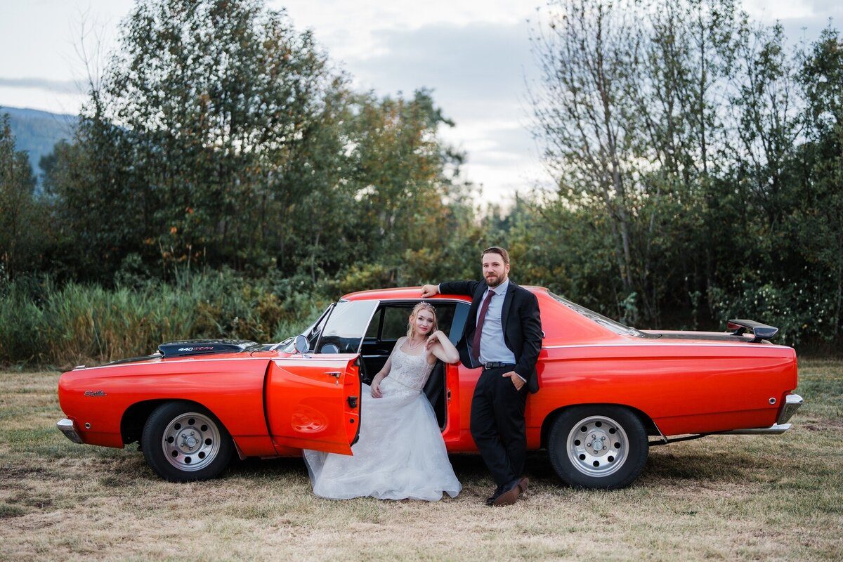 Couple arriving by classic car at Eden Farm
