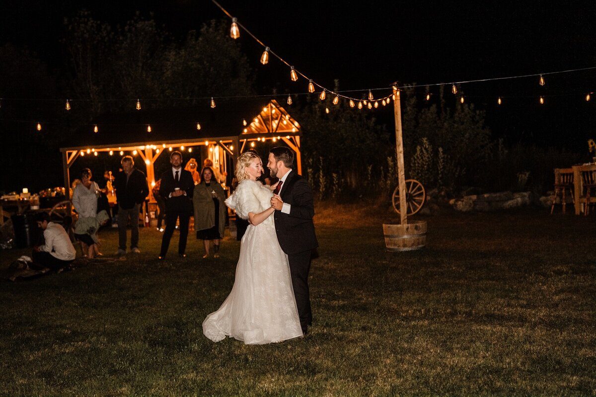 Dancing under string lights at night at Eden Farm