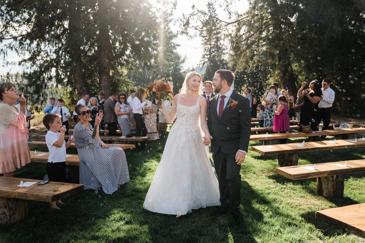 Wedding ceremony under the trees at Eden Farm